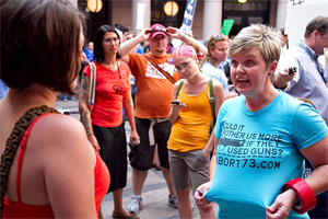 Texas Pro-Life displays her t-shirt question, Would it bother us more if they used guns