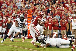 OU ryunning back Damien Williams runs the ball Saturday night against TCU.  The Sooners won the game, 20-17