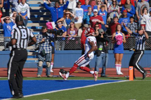 Sooner receiver Sterling Shepard crosses the goal line after catching a pass from Lacoltan Bester. The Sooners beat Kansas 34-19 Saturday