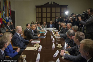 All smiles: Obama joked with tech executives before focusing on Obamacare and relegating the companies' NSA concerns to second-tier status (Photo from the Daily Mail)