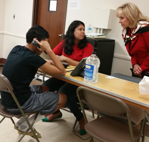 Gov. Mary Fallin talks to a caseworker and a minor being held at a temporary shelter at Fort Sill. PROVIDED PHOTO