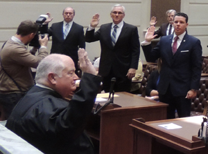 The Honorable John Reif, Chief Justice-Elect of the Supreme Court, administers the oath of office to newly elected and reelected members of the Senate.