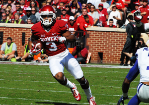 Sooner wide receiver Sterling Shepard looks for daylight against Kansas State. Coach Bob Stoops said fans shouldn't expect to see Shepard play against OSU.