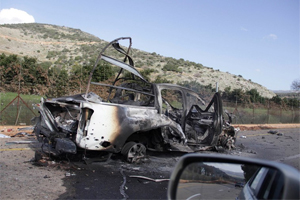 A burnt vehicle is seen near the village of Ghajar on Israel's border with Lebanon. (Photo:REUTERS/JP) 
