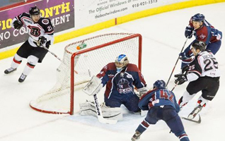 The Rush's Daniel Barczuk (25) scores the game winner against the Oilers Thursday night. Photo: Kevin Pyle