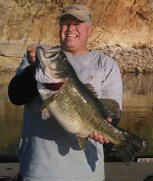 Angler Charles Jewell of Healdton showcases his Lake Murray lake-record largemouth bass. The fish weighed 12.3 pounds. The fish measured 26½ inches long and 20¼ inches in girth. (Photo by Chase Jewell - Provided)