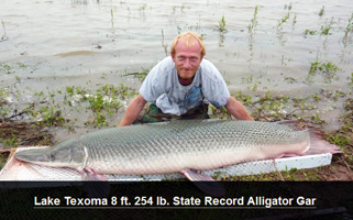 Paul Easley of Mead with his state-record alligator gar weighing 254 pounds 12 ounces.