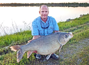 Allen Bynum of Ardmore with his state-record bighead buffalo weighing 60 pounds 6 ounces