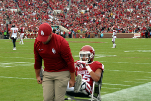 OU cornerback Zack Sanchez is wheeled off the field after suffering an ankle injury on the first play against Texas Tech Saturday in Norman.