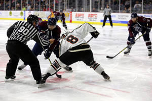 Brandon Wong of the Oilers settles in for the face off with Quad City's Matthew Neal.