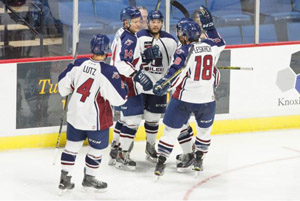 The Oilers celebrate Brandon Wong's (center) goal in the first period on Sunday. Photo: Kevin Pyle