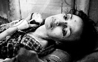 Polina, 37, rests in a hospital bed in St. Petersburg, Russia, in 2011. She is severely malnourished and suffers from numerous diseases, including tuberculosis, hepatitis C and HIV. 